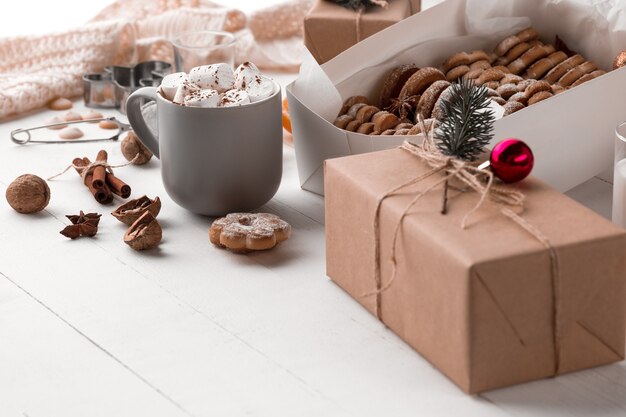 Winter composition. Gifts and cup with marshmallow