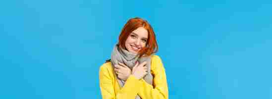 Free photo winter holidays sales and shopping concept waistup portrait cute and lovely redhead woman wrap neck