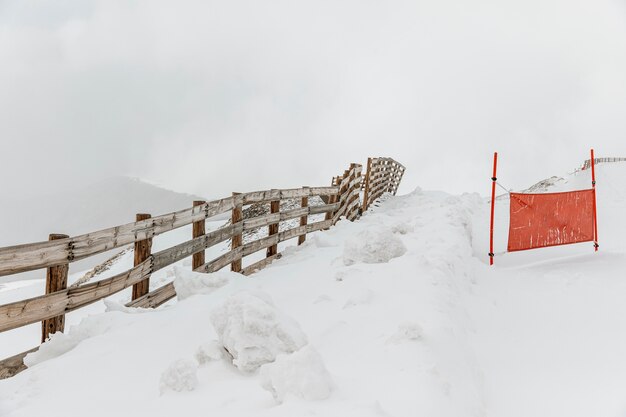 Winter landscape with fence