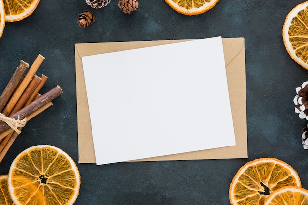 Winter lemon slices and cinnamon rolls with papers