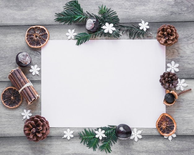 Winter symbols around paper sheet