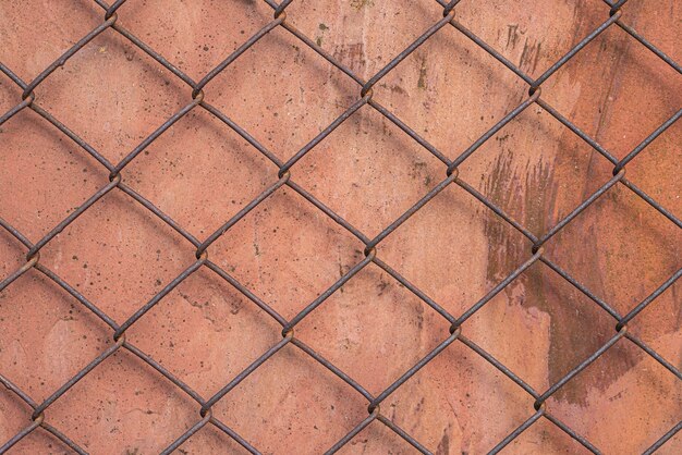 Wire fence on top of metal surface