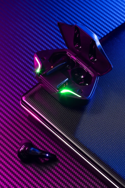 Wireless earbuds with neon cyberpunk style lighting