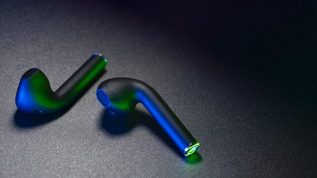 Wireless earbuds with neon cyberpunk style lighting