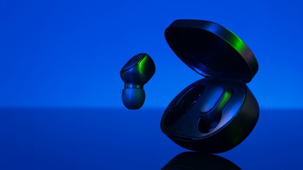 Wireless earbuds with neon cyberpunk style lighting