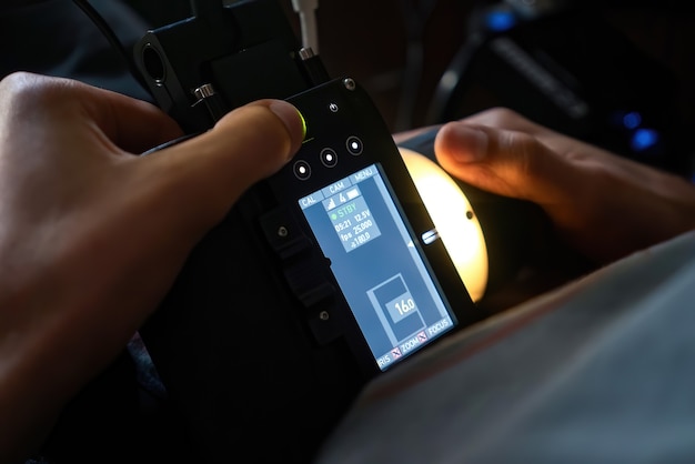 Wireless focus puller in the hands of a professional on a movie set