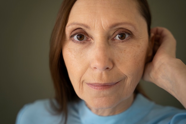 Wise woman posing in studio front view