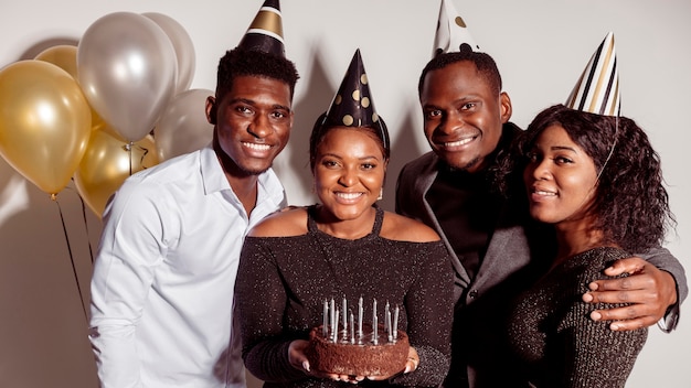 Free photo wishing happy birthday and woman holding cake