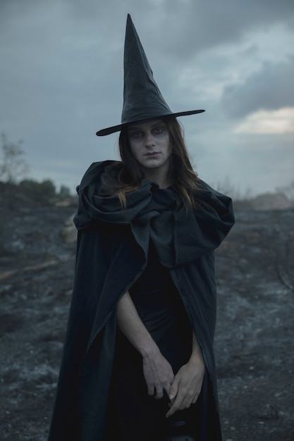 Free photo witch black hat and clothes man