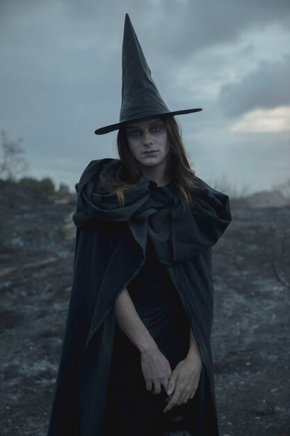 Witch black hat and clothes man