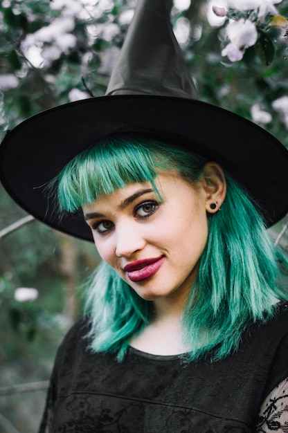 Witch in hat looking at camera