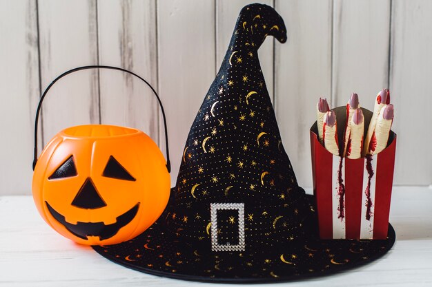 Witch hat with jack-o-lantern and severed fingers