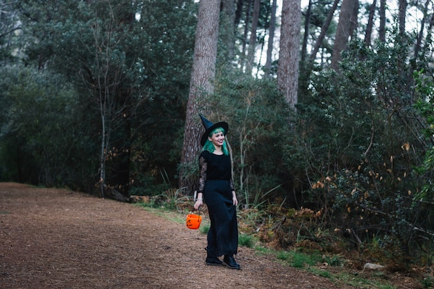 Witch smiling in wood