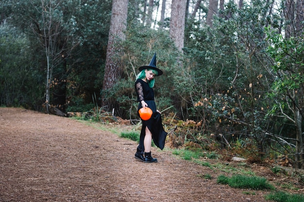 Free photo witch standing on wood path