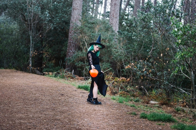 Witch standing on wood path
