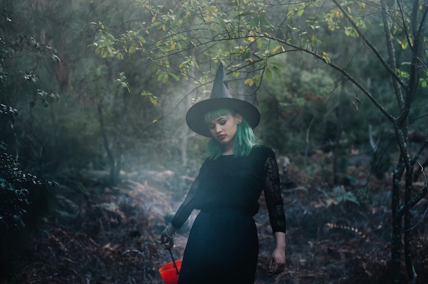 Witch walking in wood