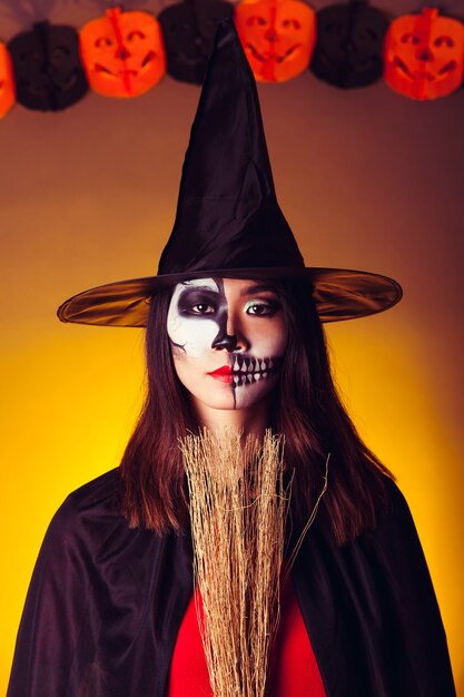 Witch with broom and hat