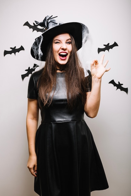 Free photo witch woman gesturing ok