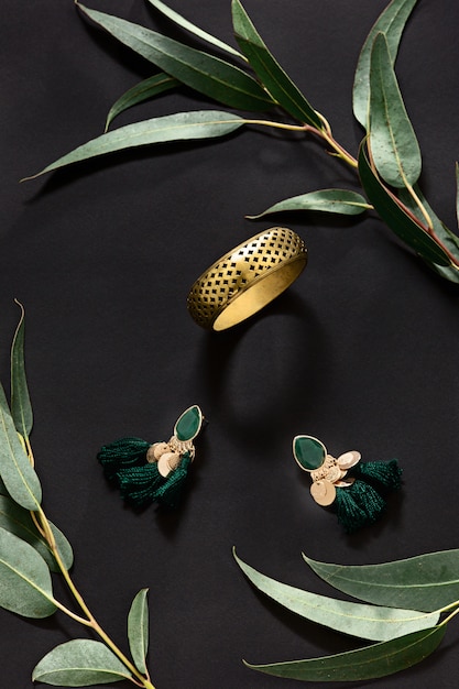 Woman accessories with leaves on black