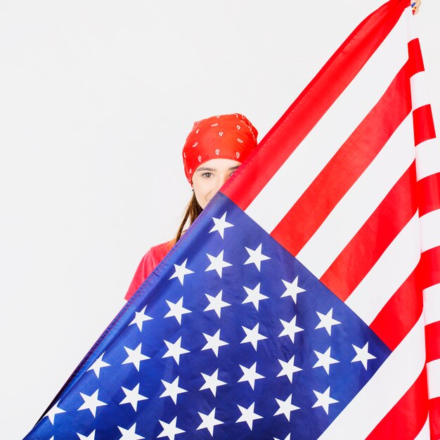 Woman behind american flag