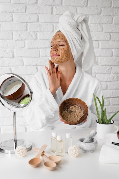 Woman applying homemade remedy concept