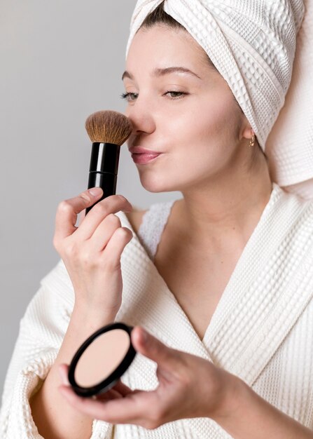 Woman applying powder