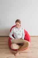 Free photo woman on armchair