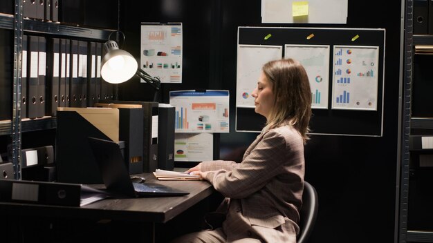 woman arrives in office with laptop bag