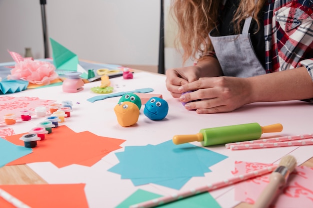 Woman artist making creative craft art on desk