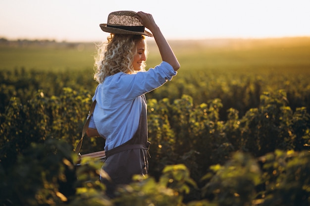 Woman artist painting with oil paints in a field