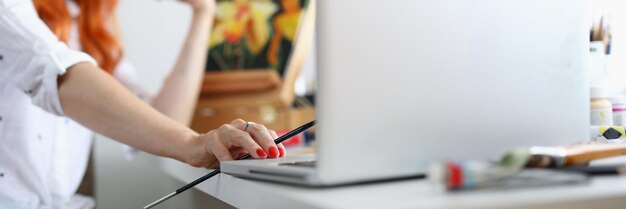 Woman artist with red nails