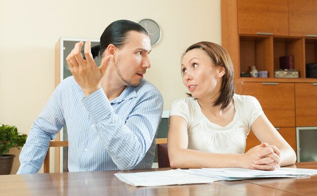 woman asking for money from  husband for the purchase