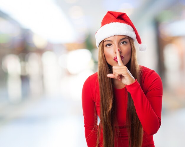 Woman asking for silence in a shopping center