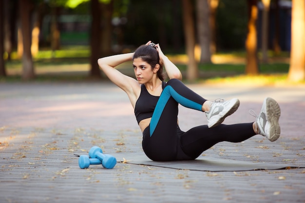 Woman athlete training in the city street