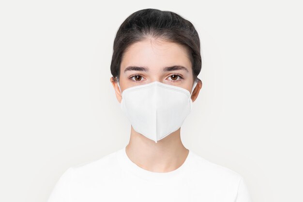 Woman in basic white mask  for COVID-19 protection campaign