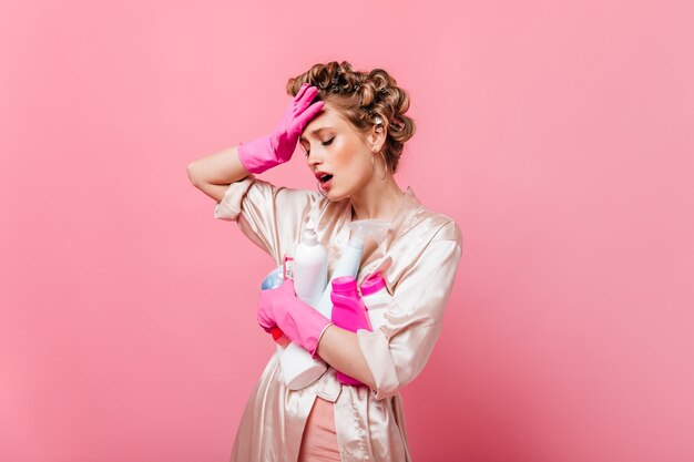 woman in bathrobe is tired of cleaning