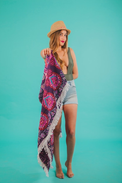 Woman in beachwear holding towel