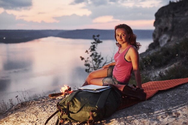 Free Photo woman next to a beautiful landscape