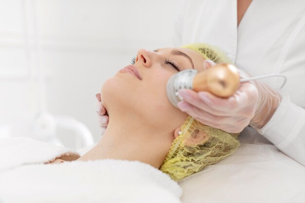 Woman at beauty clinic for face treatment