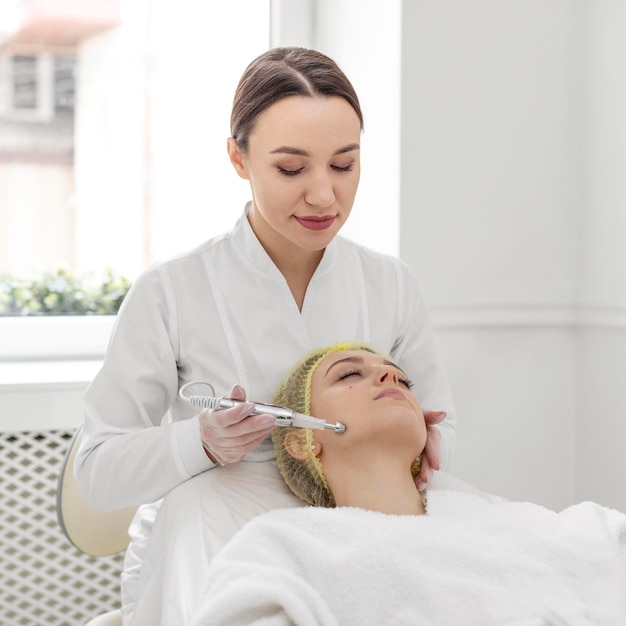 Woman at beauty clinic for filler treatment