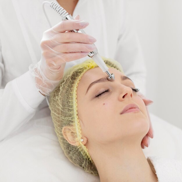 Woman at beauty clinic for filler treatment