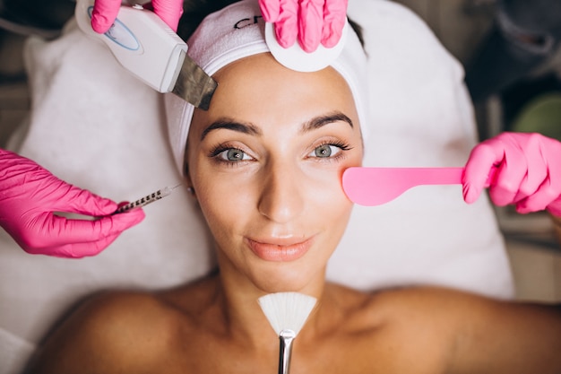 Woman a beauty salon making cosmetic procedures