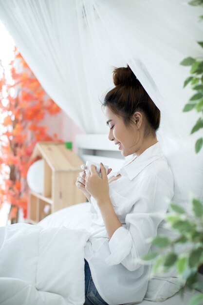 woman on the bed in the house