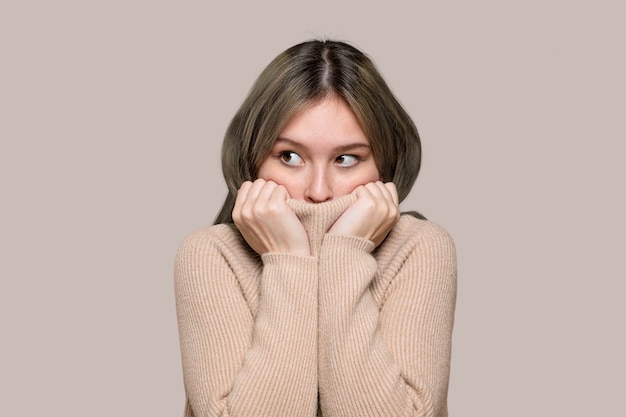 Woman in a beige sweater