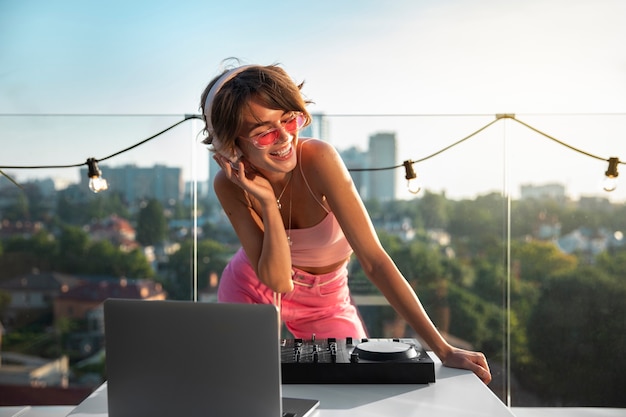 Woman being dj at party front view