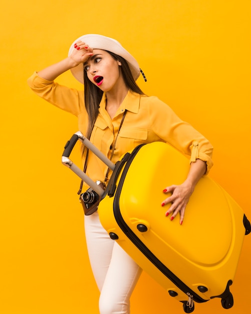 Woman being exhausted of carrying luggage for trip