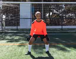 Free photo woman being goalkeeper full shot