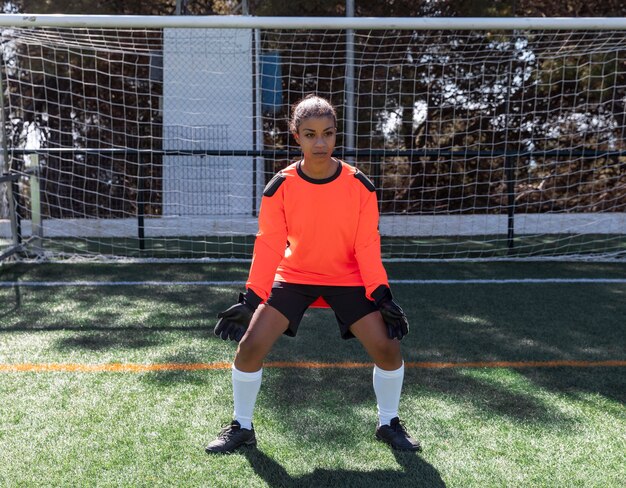 Woman being goalkeeper full shot