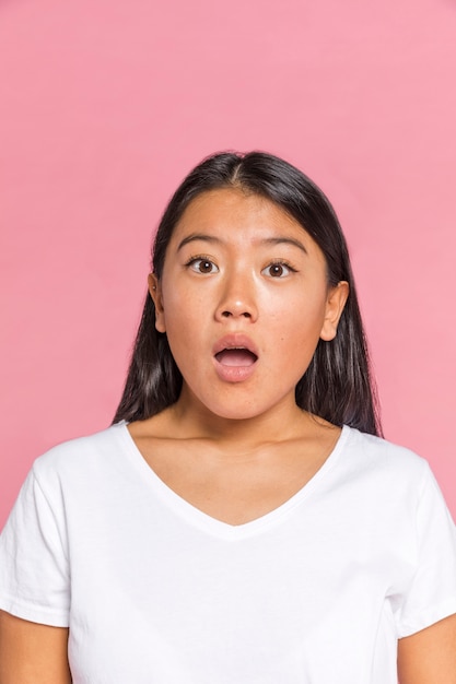 Woman being surprised and looking at camera