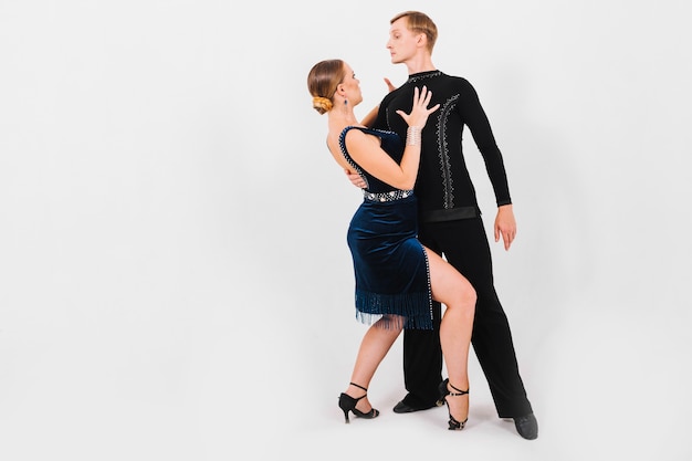 Free photo woman bending knees and touching dance partner